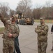 Maj. Hormann explains vehicle equipment to Werner and Dean