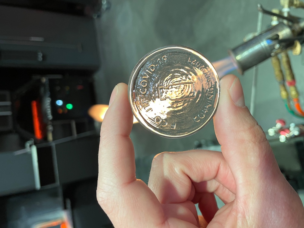 Corning Museum makes glass challenge coin for vaccine team