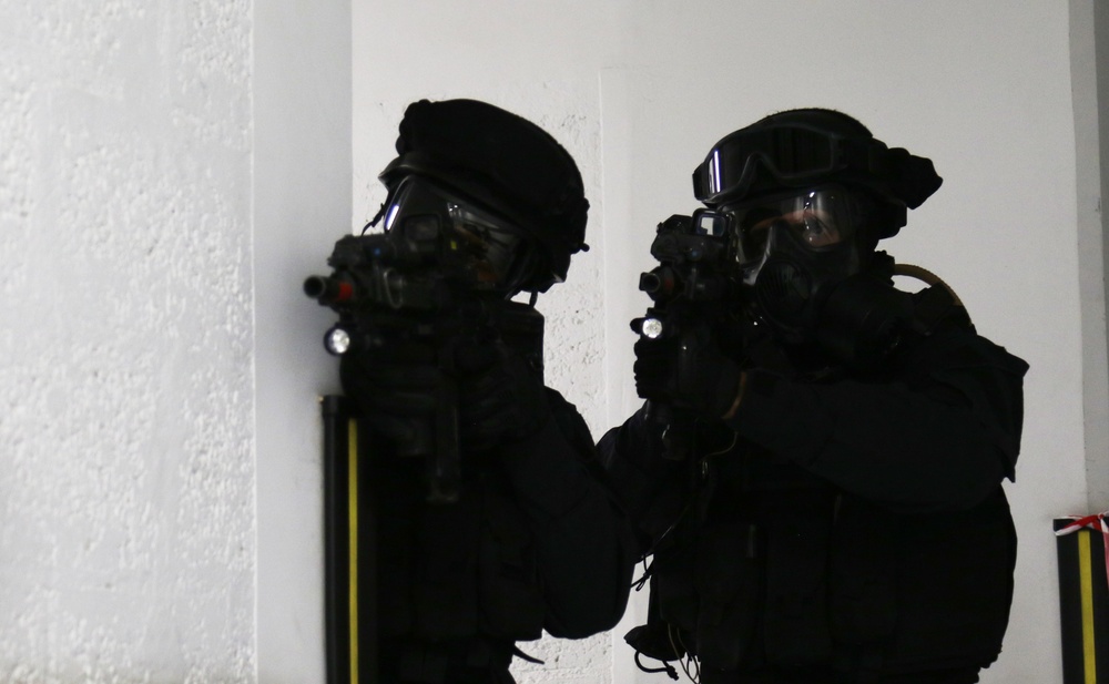 Qatari Special Forces secure a corner during simulated crisis at IS 21