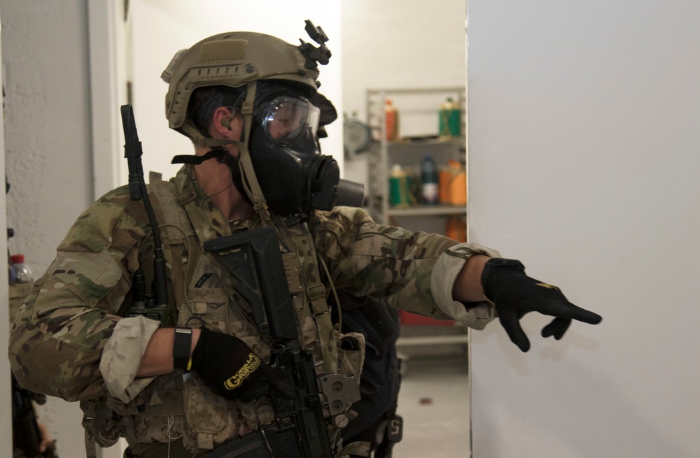 A U.S. Special Operations Forces member reacts in simulated crisis during IS 21