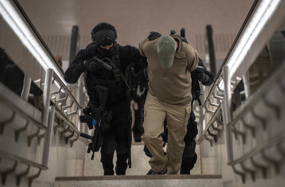 Qatari Special Forces escort a restrained gunman role-player during IS 21