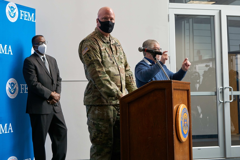 Dual Status Commander speaks to local media at the Esperanza Community Vaccination Center in Philadelphia