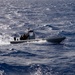 Coast Guardsmen and Sailors participate in an aerial use of force (AUF) exercise