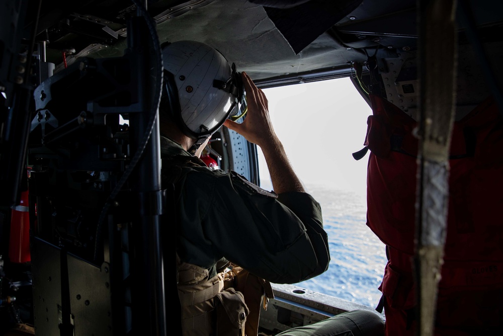 Naval Aircrewman 2nd Class Jackson Stoff participates in an aerial use of force (AUF) exercise while underway April 6, 2021.