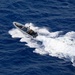 Coast Guardsmen and Sailors participate in an aerial use of force (AUF) exercise