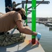 Sailor conducts preventative maintenance