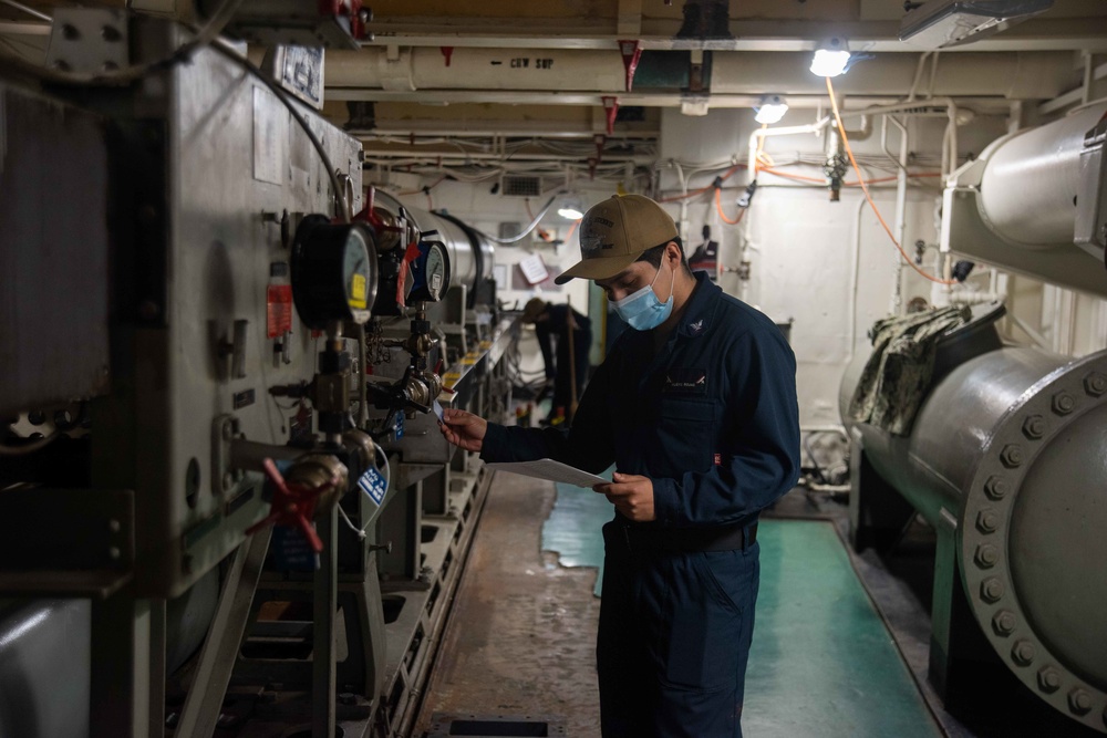 U.S. Sailor performs maintenance