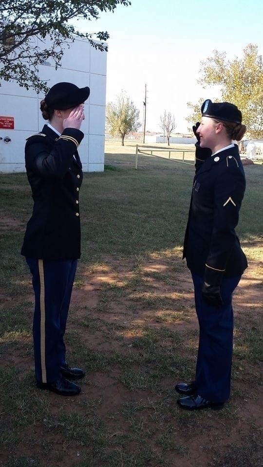 Pvt. Olivia Robinson, combat medic with the 294th Medical Battalion salutes her Capt. Allison Evans