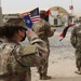 U.S. Army Soldiers from the Intelligence and Sustainment Company, 36th Infantry Division, Task Force Spartan, salute the U.S. Flag during the playing of the National Anthem