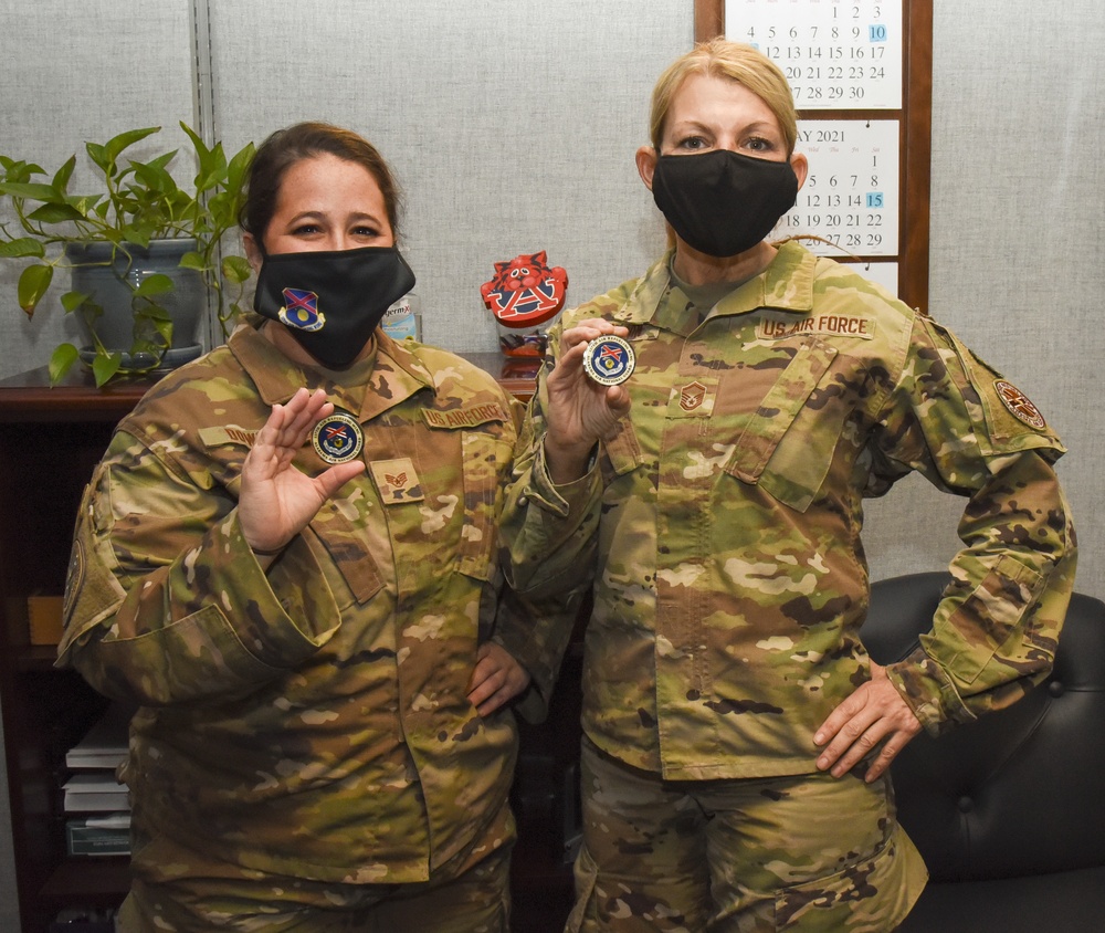 Staff Sgt. Amanda Downey and Master Sgt. Lynn Johnson Receive Coins