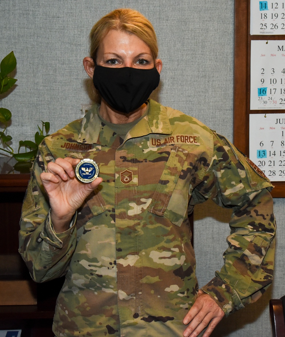 Master Sgt. Lynn Johnson Receives a Coin