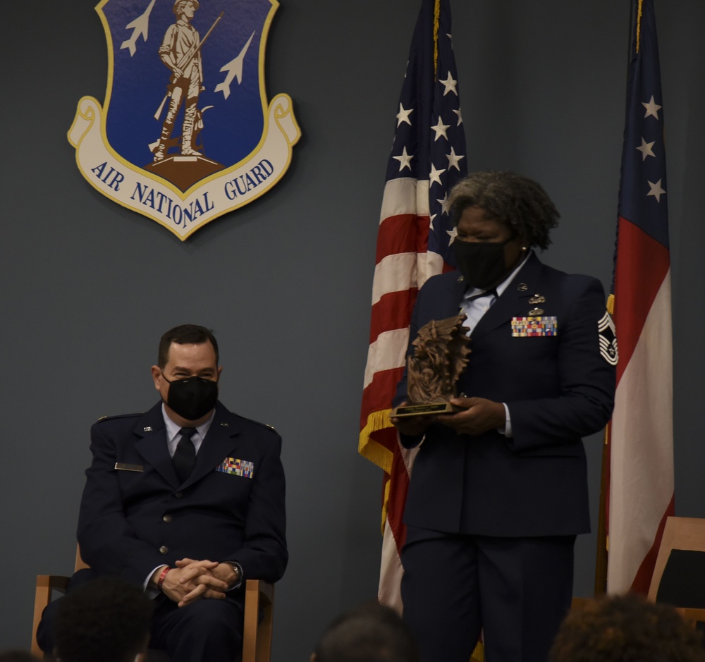Chief Master Sgt. Pamela Gantt receives the bronze chief bust