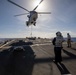 USS Barry conducts a vertical-replenishment with a Puma helicopter, assigned to USNS Charles Drew