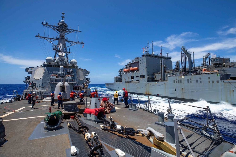USS Barry conducts a replenishment-at-sea with USNS Charles Drew