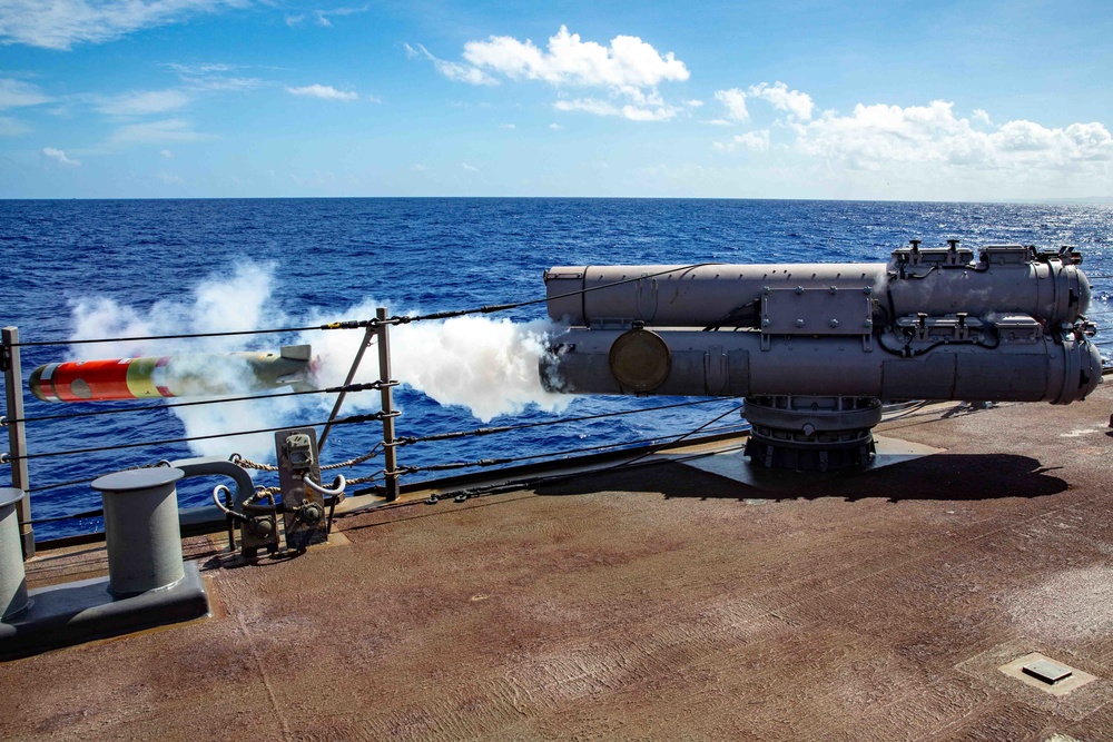 USS Barry conducts a live fire exercise with a torpedo launcher