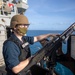 Fire Controlman 2nd Class Jacob Lugviel mans the .50-cal during a sea and anchor detail aboard the USS Barry