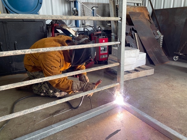 NMCB 11 Welds Gear Racks for Supply on Camp Covington