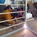 NMCB 11 Welds Gear Racks for Supply on Camp Covington