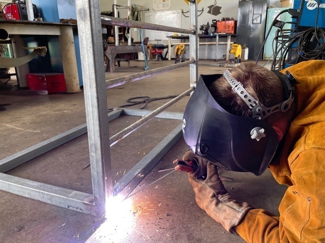 NMCB 11 Welds Gear Racks for Supply on Camp Covington