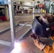 NMCB 11 Welds Gear Racks for Supply on Camp Covington