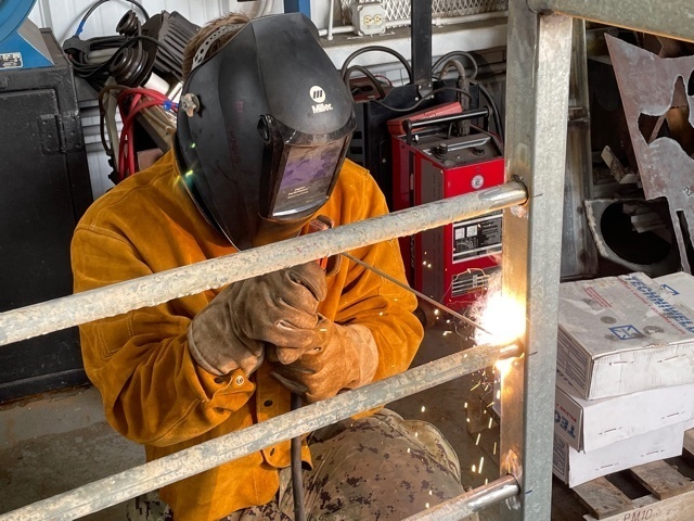 NMCB 11 Welds Gear Rack for Supply on Camp Covington