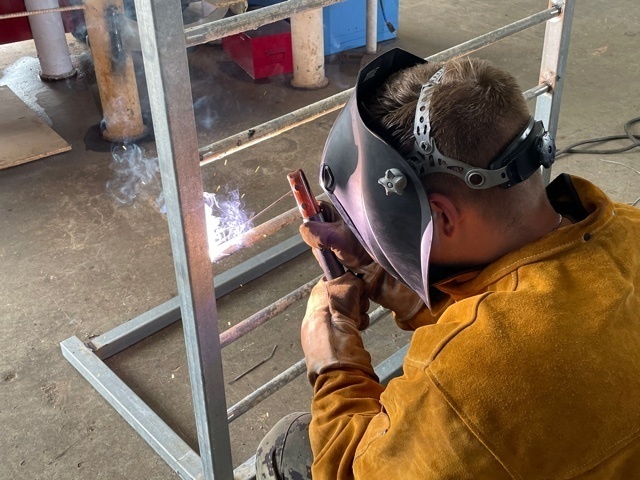 NMCB 11 Welds Gear Rack for Supply on Camp Covington
