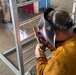 NMCB 11 Welds Gear Rack for Supply on Camp Covington