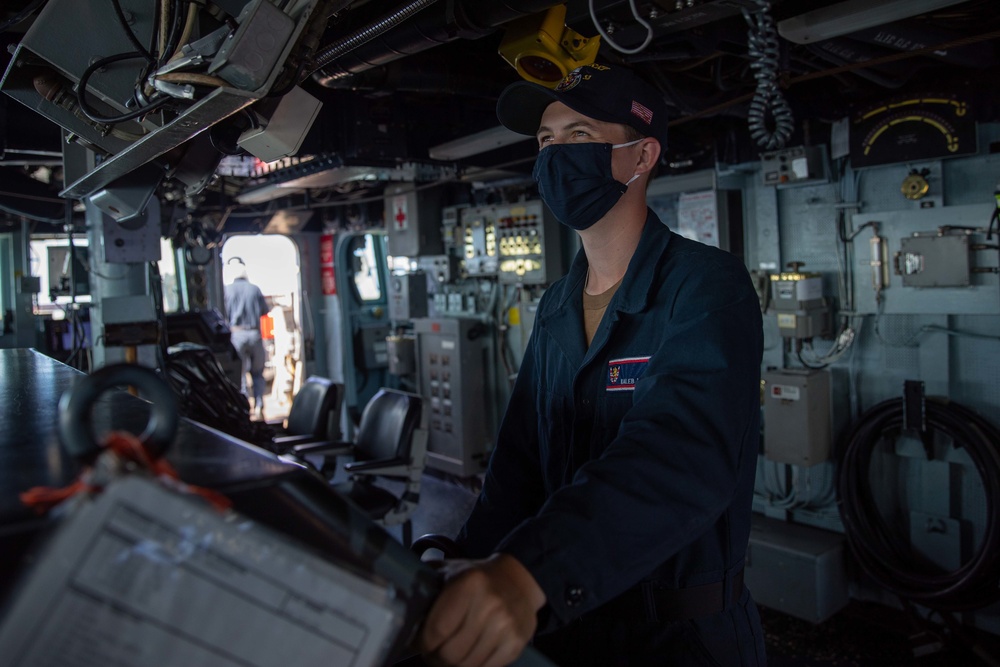 Seaman Kaleb Hall stands the helmsman watch aboard the USS Barry