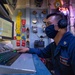 Gas Turbine System Mechanic Chief D.J. Anis, mans the propulsion auxiliary control console aboard the USS Barry