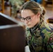 Swiss KFOR soldier plays piano at Bondsteel chapel