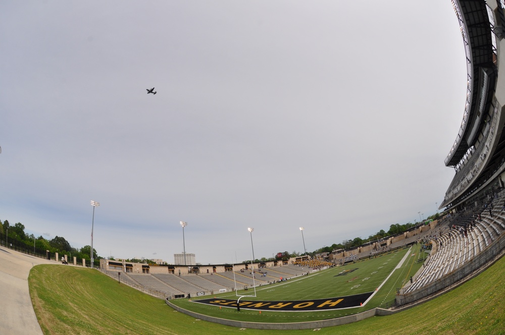 Football game flyover symbolizes partnership, promise