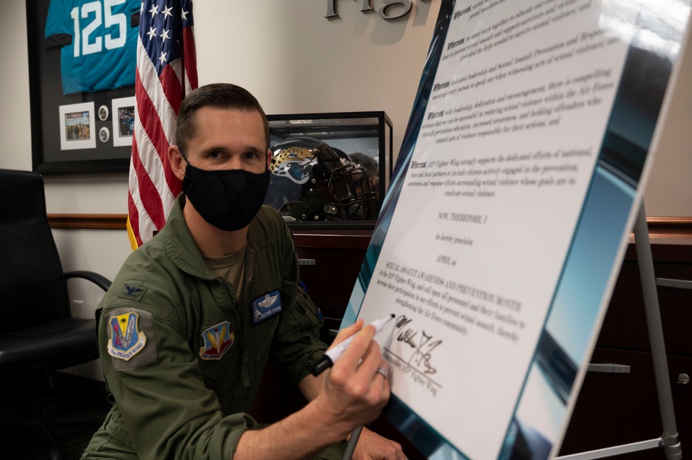 125th Fighter Wing commander signs SAPM proclamation