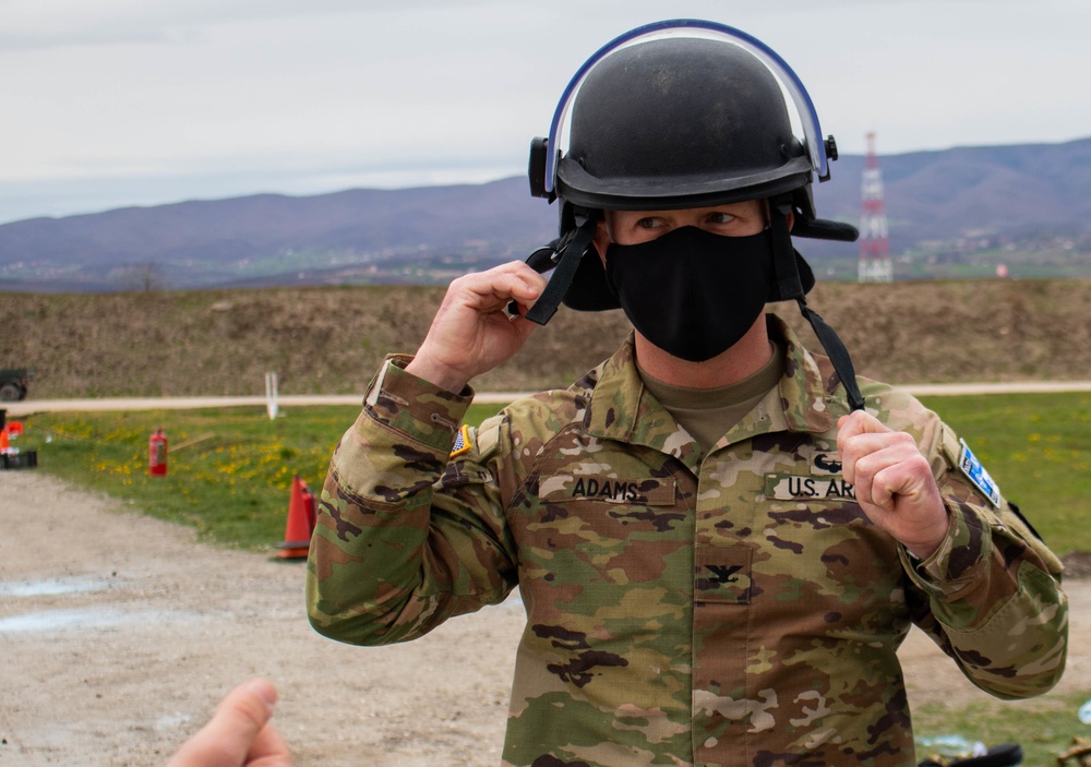 RC-E KFOR commander dons CRC helmet