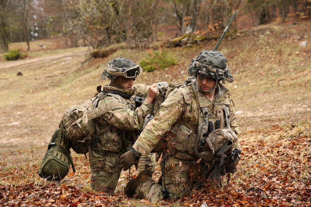 Soldier Helps Fellow Soldier With Radio