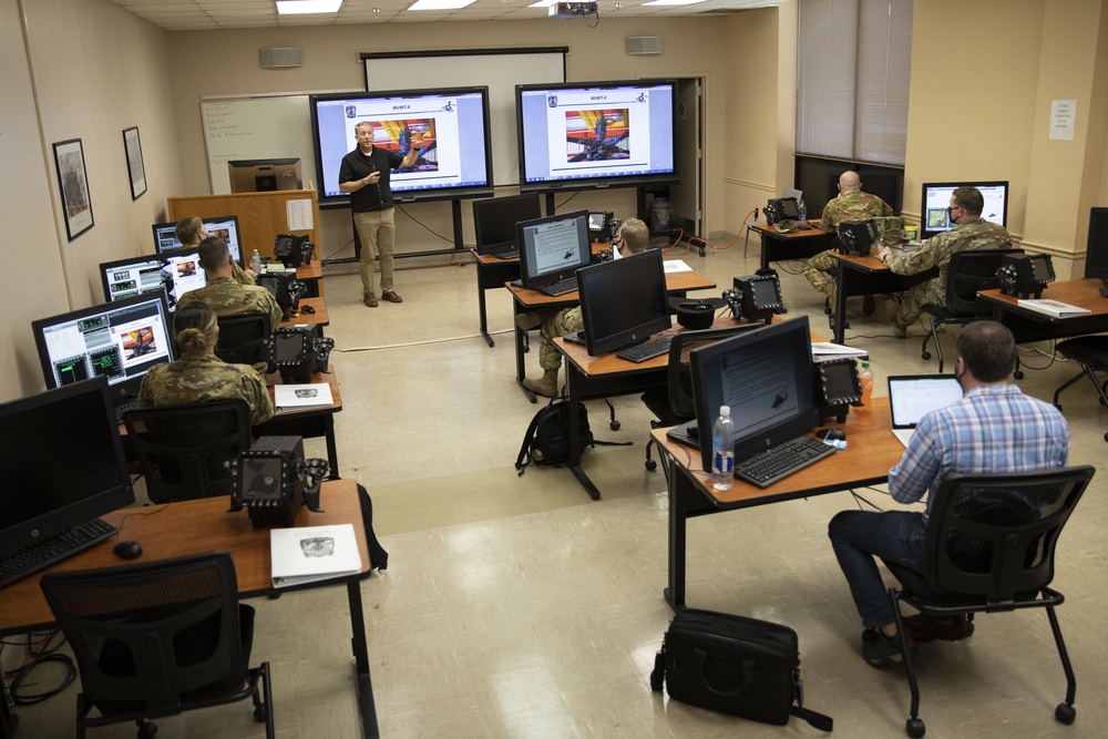 Marne Air Soldiers learn the newest version of the AH-64E Apache helicopter.