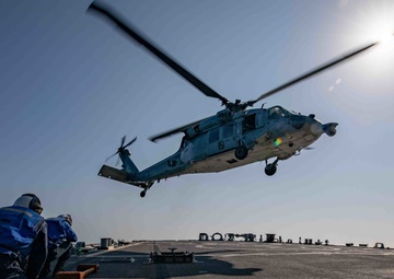 USS Barry conducts flight operations with Helicopter Combat Squadron 8