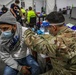 Soldier administers vaccine to his brother in Chicago