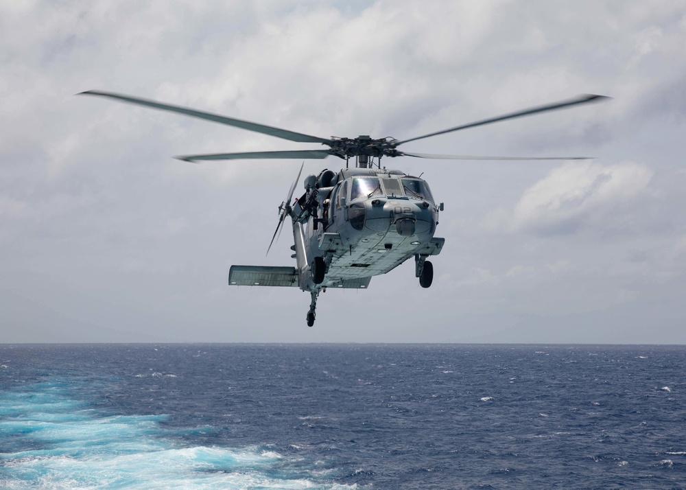 Helicopter Sea Combat Squadron (HSC) 22, Detachment 3, lands aboard the flight deck of the Freedom-variant littoral combat ship USS Sioux City