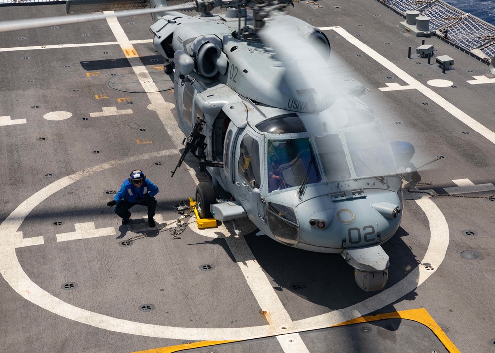 Helicopter Sea Combat Squadron (HSC) 22, Detachment 3, lands aboard the flight deck of the Freedom-variant littoral combat ship USS Sioux City