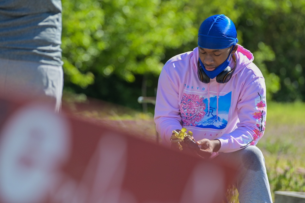 Illinois National Guard Service Member Volunteer Gardening Service in East St. Louis