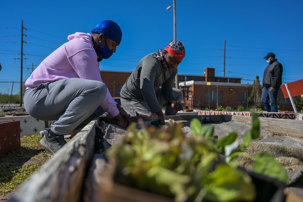Illinois National Guard Service Member Volunteer Gardening Service in East St. Louis