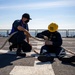Sailors assigned to the Freedom-variant littoral combat ship USS Sioux City (LCS 11) repair lines on the ship’s flight deck
