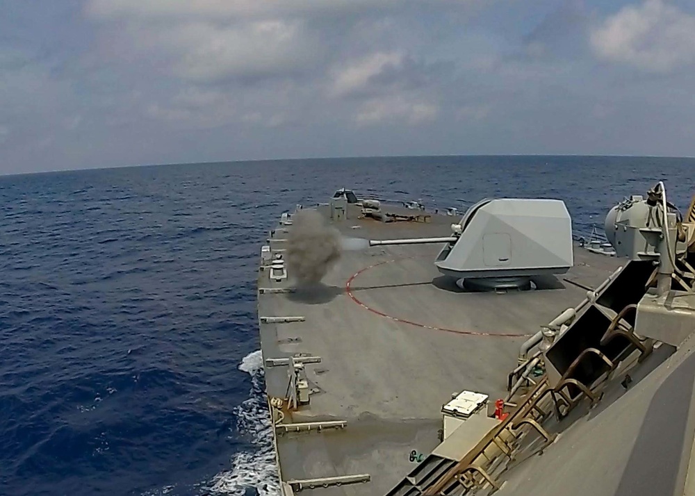 USS Sioux City fires the 57mm MK 110 gun while conducting a live-fire exercise