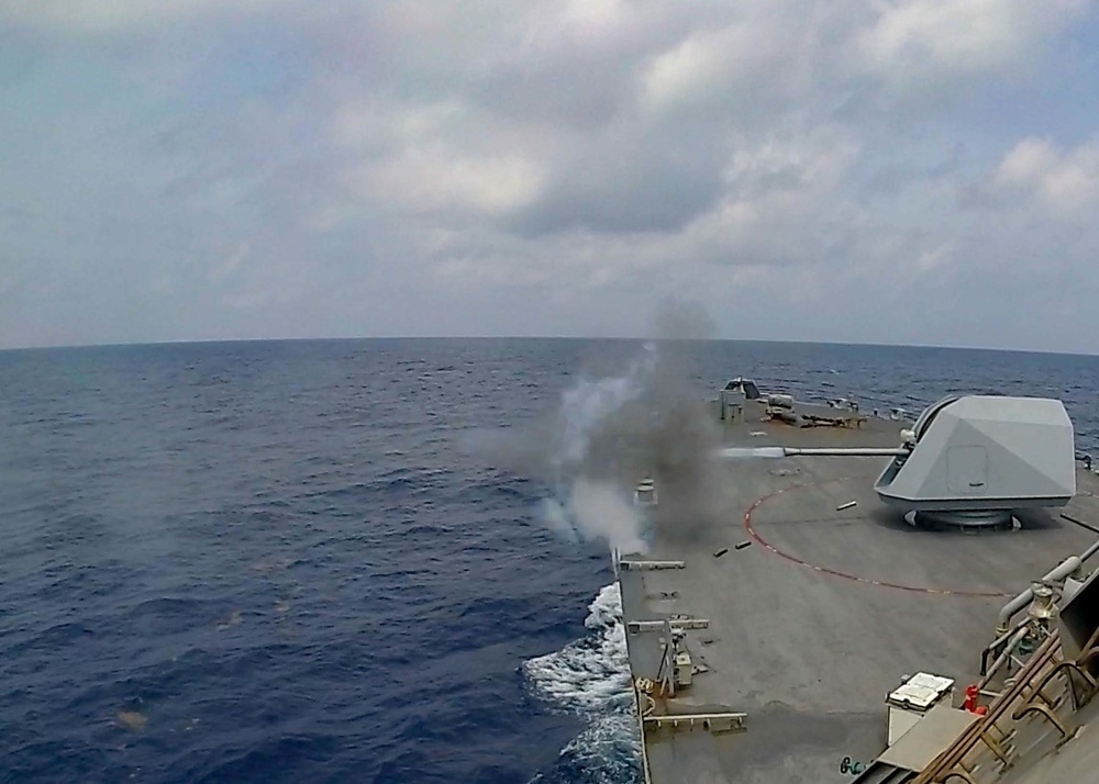 USS Sioux City fires the 57mm MK 110 gun while conducting a live-fire exercise