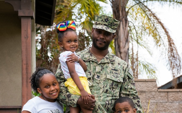 Service Member Poses for Month of the Military Child Photo