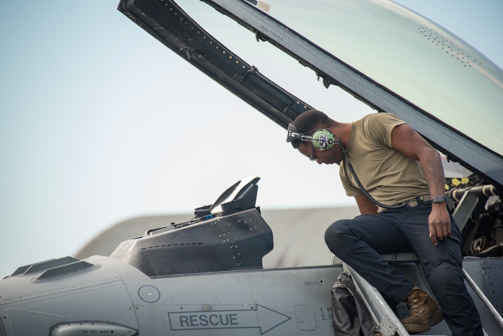 U.S Air Force crew chief performs post-flight checks in F-16 Fighting Falcon
