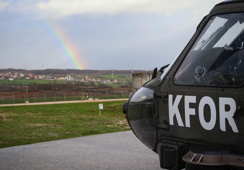UH-60 Blackhawk rests under rainbow at Camp Bondsteel