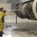 Photo of Team JSTARS personnel scrubbing aircraft in ISO Dock