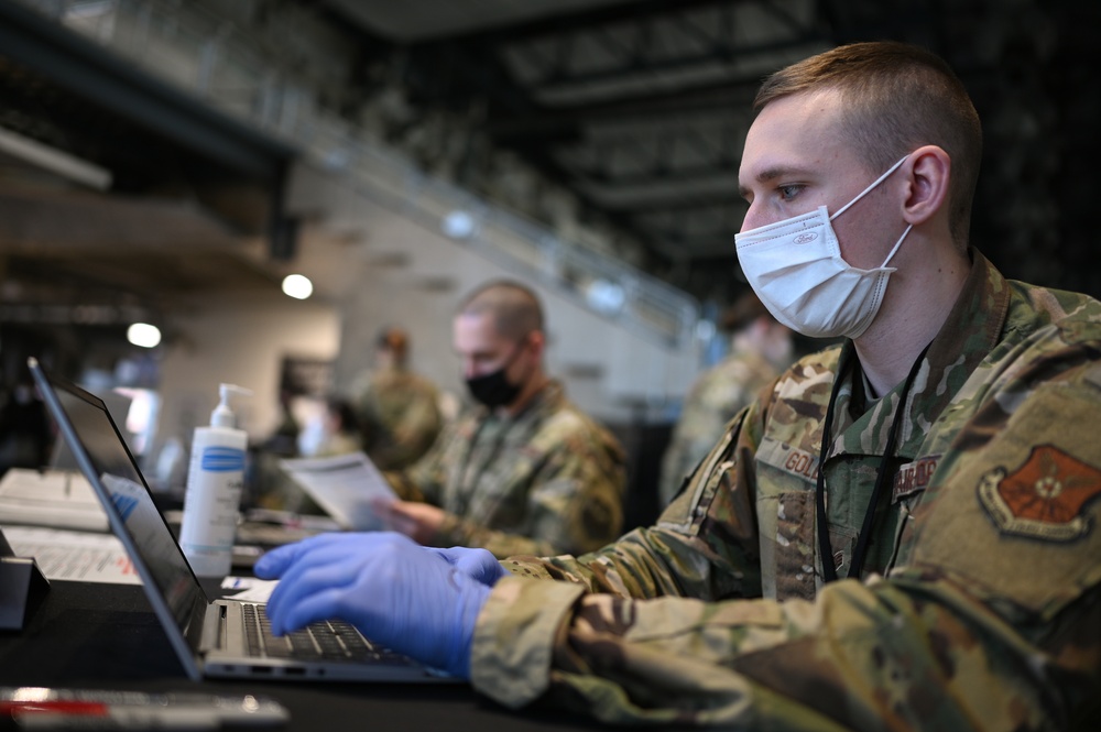 Airmen register community members at Ford Field CVC in Detroit