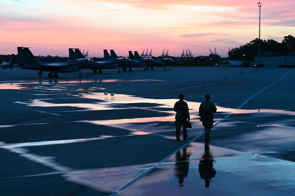 Airmen walk on flight line during Sentry Savannah